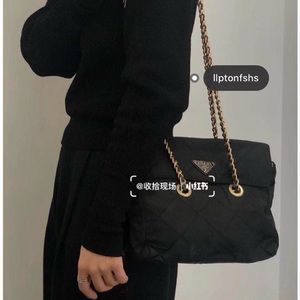 “Prada” black nylon purse with long golden chains